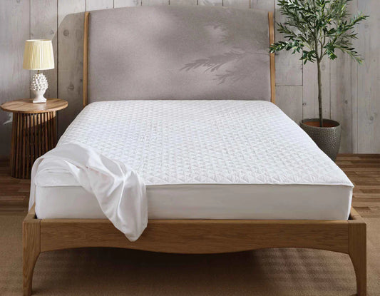 A waterproof mattress cover is a thin, protective layer that fits snugly over your mattress